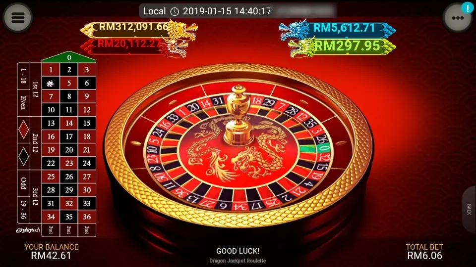 Dragon Jackpot Roulette wheel with a gold dragon in the centre, four jackpot counters with gold, red, blue and green dragons above it and a vertical betting grid on the left