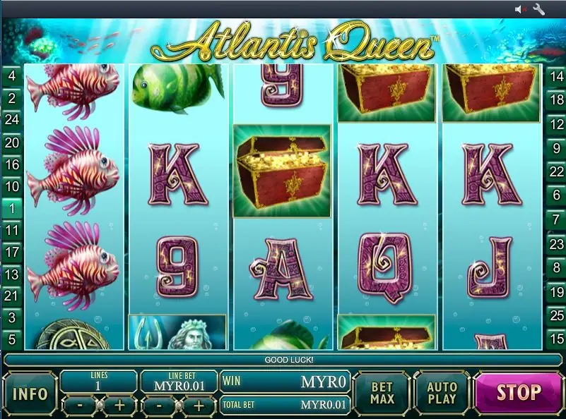 Mid-spin with three lionfish stacked on reel 1, treasure chests on reels 3, 4 and 5, pink K's across the middle and the STOP button lit